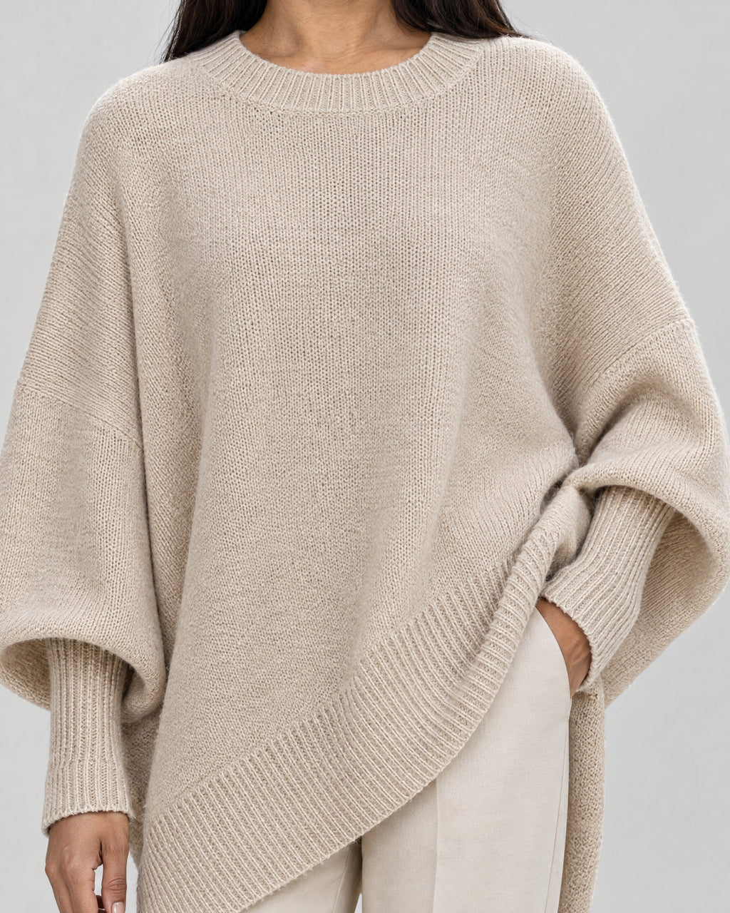 Strickponcho – Detail Strick und Saum
